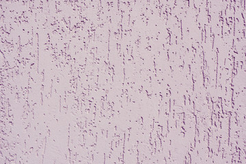 Abstract background and texture of a lilac plastered wall with bark beetle texture...