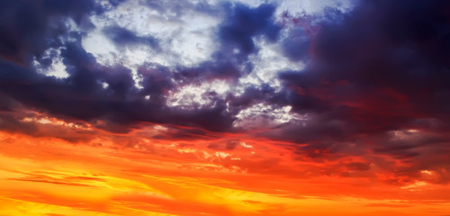 natural texture of fabulous sunset bright sky with different shades of pink and lilac tints on the Golden clouds