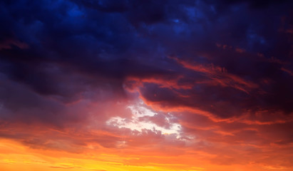 natural texture of fabulous sunset bright sky with different shades of pink and lilac tints on the Golden clouds