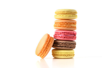 Fototapeta premium Set of colorful macaroons on isolated white background. Fresh multicolor macaroons.