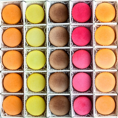 Set of colorful macarons in the box. The view from the top.Fresh multi-color macaroons or macarons