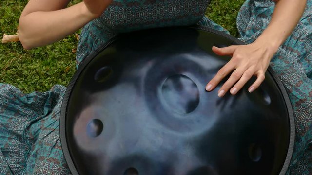 Woman hands on Swiss han drum