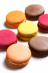 Set of colorful macaroons on white background.