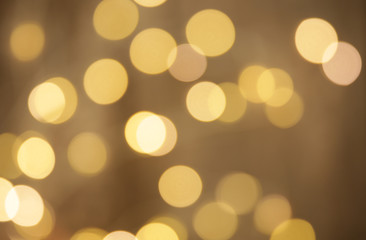 abstract background with gold lights. Gold bokeh banner. Golden glitter. Festive sparkles. Empty background. Blurry texture. Defocus pattern. Abstract template. Retro background. Vintage confetti .
