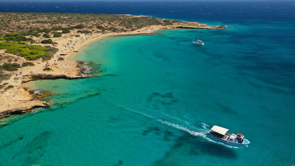 Aerial drone photo of iconic breathtaking turquoise sandy beach of Platia Pounta or Italida in famous island of Koufonissi, Small Cyclades, Greece