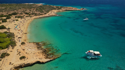 Aerial drone photo of iconic breathtaking turquoise sandy beach of Platia Pounta or Italida in famous island of Koufonissi, Small Cyclades, Greece