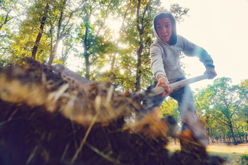 A man buries the ground with a shovel and throws it from above, a view from inside from below.
