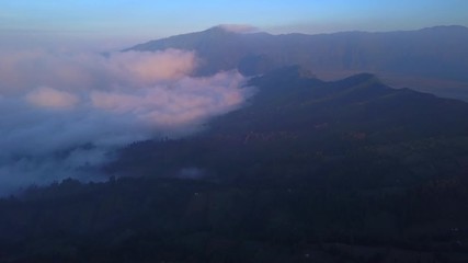 AERIAL: Landscape next to caldera Bromo volcano in sunrise time, Java island, Indonesia
