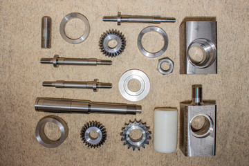 Various steel parts made on CNC metalworking machines.