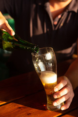 man Pouring beer into glass. background object alcohol, oktoberfest concept