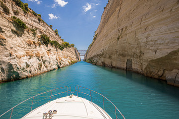 Passing through the Corinth Canal by yacht, Greece. The Corinth Canal connects the Gulf of Corinth with the Saronic Gulf in the Aegean Sea.