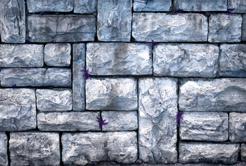 Old sidewalk made of gray rough stone