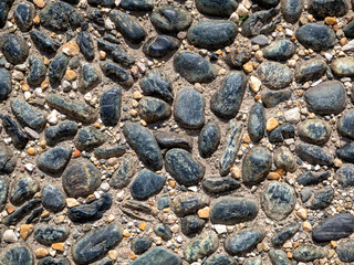 The uneven surface of the cobblestone pavement