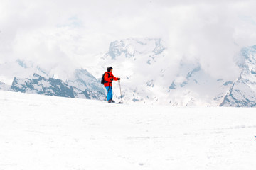 Fototapeta na wymiar child skiing on a snowy mountain slope, Caucasus,