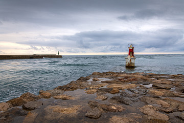 Seascape with two lighthouses, a cloudy afternoon on the coast of Cantabria, Spain