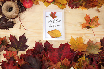 Autumn leaves frame on wooden background, flat lay, copy space. Hello autumn., Wooden frames with maple leaves