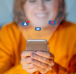 Woman using mobile with social network notifications icons