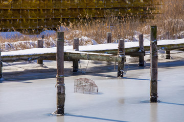 crab trap frozen in ice southern maryland chesapeake bay usa