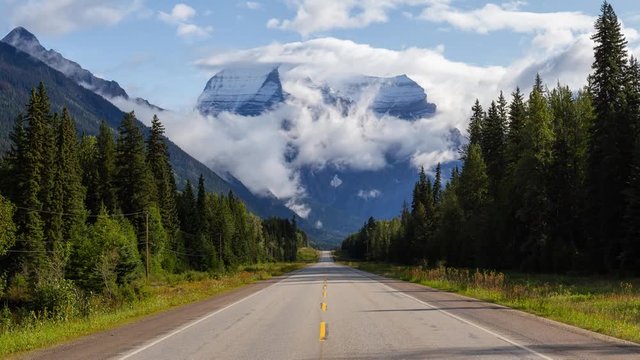 Cinemagraph of a Beautiful Yellowhead Highway with Mount Robson in the background during a cloudy summer morning. Taken in British Columbia, Canada. Still Image Continuous Loop Animation