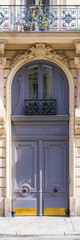 Paris, beautiful wooden door, typical gate and window in the Marais