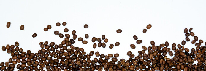 coffee beans on a white background. Panoramic shot. Concept - morning with coffee. Copy space