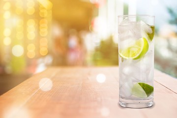 Glass of water  and lime on  background