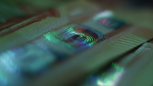The Security Features Of The Euro Banknotes. The Light Moves Up