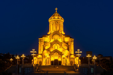 Fototapeta na wymiar Famous Orthodox Holy Trinitiy Sameba church illuminated with golden light.