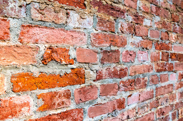 Rough red brick wall as background texture