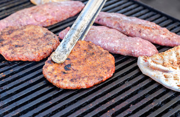 Pieces of grilled meat cooked on the grill