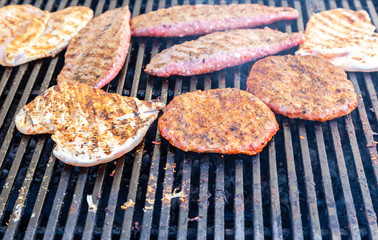 Pieces of grilled meat cooked on the grill
