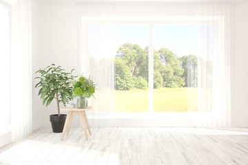 Fototapeta premium Stylish empty room in white color with summer landscape in window. Scandinavian interior design. 3D illustration