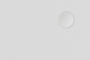 White plastic surface with single blank button template and background