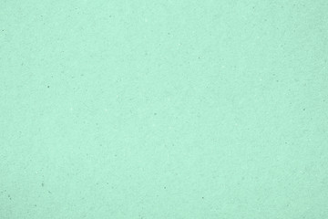 Texture of paper, light green mint color. Recyclable material, has small inclusions of cellulose