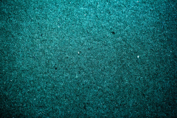 Vintage paper texture cardboard background close-up, dark mint green color. Grunge old paper surface texture