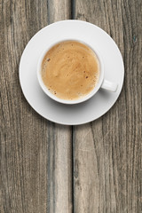 Cup of coffe on a table wood