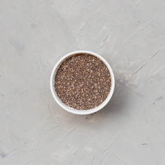 Chia seeds in bowl from top view with space. Clean eating, detox, dieting, vegetarian food concept