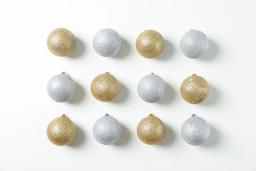 Flat lay with christmas balls on white background, space for text