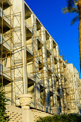 Construction of the new modern residential building in Hurghada, Egypt. Wooden scaffolding around the building