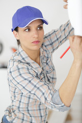 female technician marking the wall