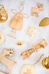 Christmas card. A lot of christmas gold baubles and decoration on snow