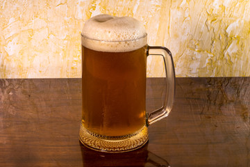 a glass of foam viv with a table