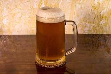 a glass of foam viv with a table