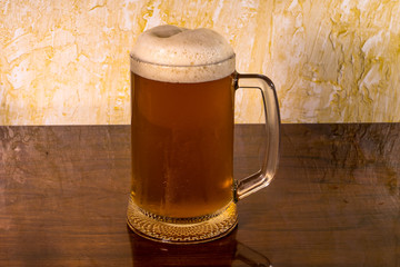 a glass of foam viv with a table