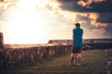 Pensive man woman embracing together looking into the distance light concept love hope togetherness