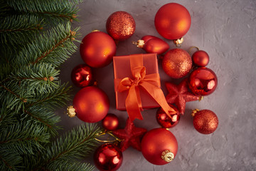 Christmas background. Set with a lot of different baubles over grey concrete background. Christmas preparation concept