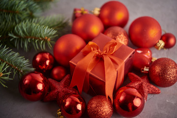 Christmas background. Set with a lot of different baubles over grey concrete background. Christmas preparation concept