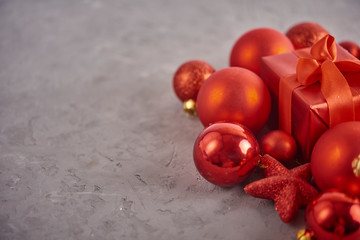 Christmas background. Set with a lot of different baubles over grey concrete background. Christmas preparation concept