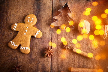 Christmas background. Christmas preparation, gingerbread man over wooden background