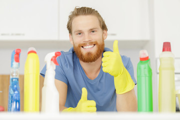 young male professional cleaner with thumb up